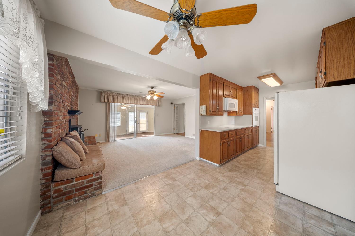 1500 Crestview Drive Modesto, CA 95355 - Photo 12 of 32 a living room with furniture and a chandelier