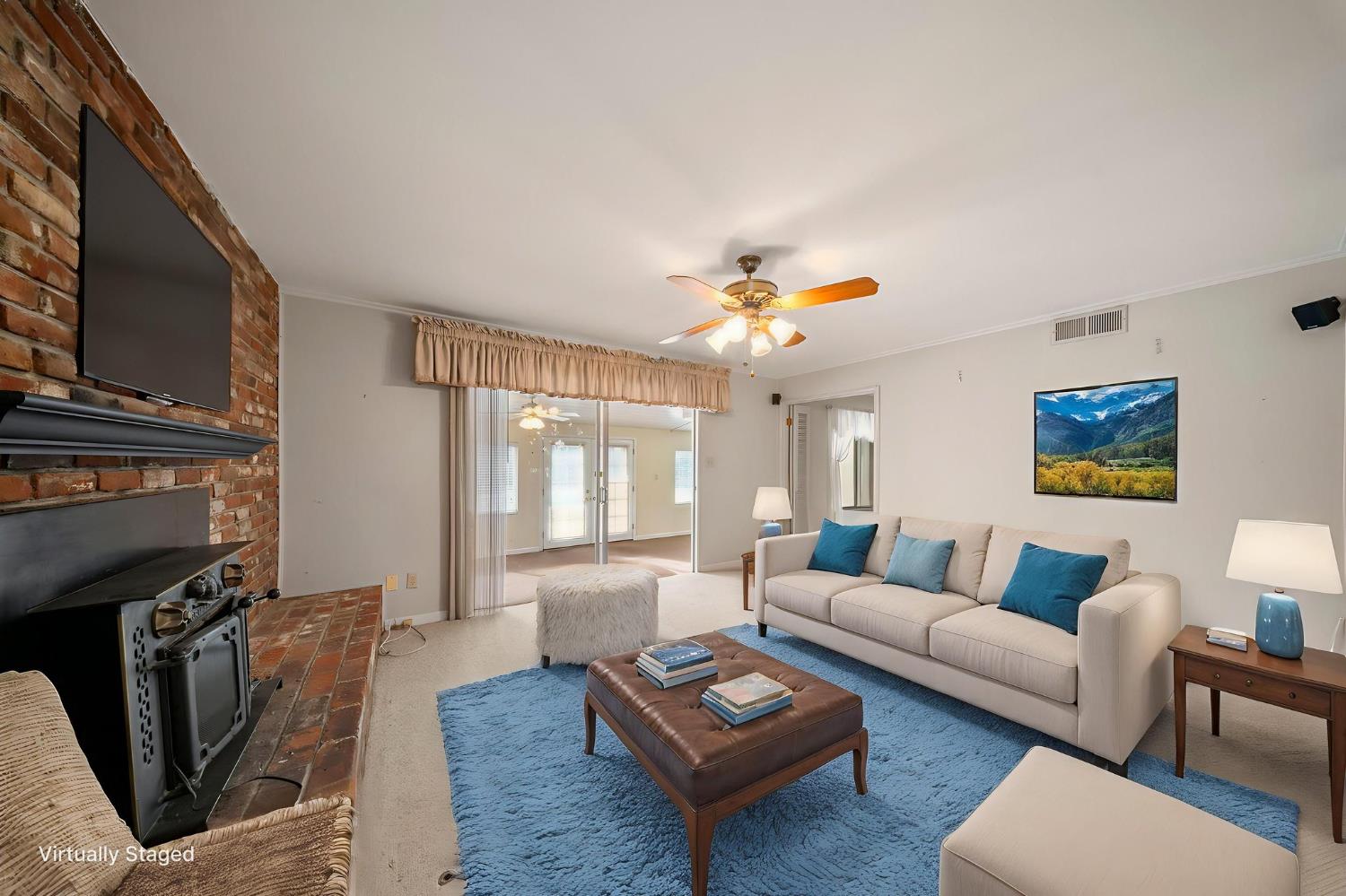 1500 Crestview Drive Modesto, CA 95355 - Photo 10 of 32 a living room with furniture and a fireplace