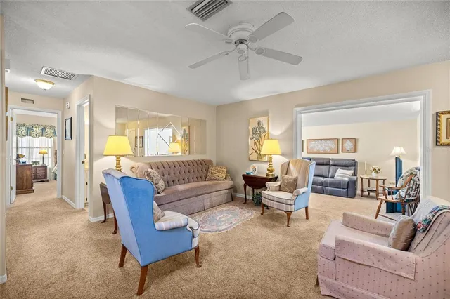 a living room with furniture and white walls