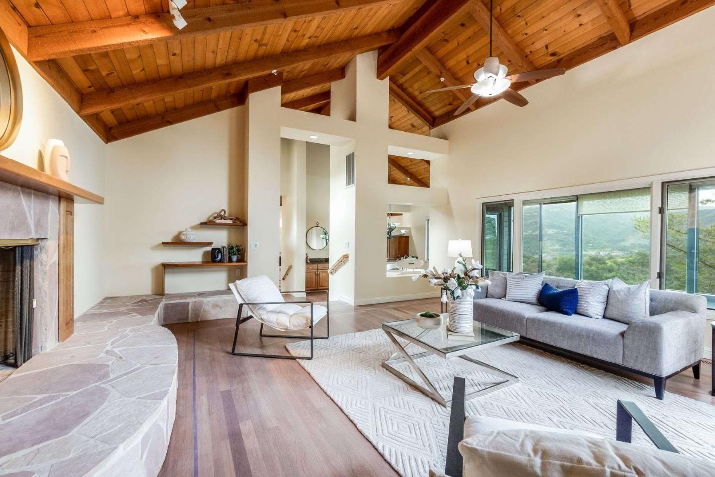 22340 Regnart Road Cupertino, CA 95014 - Photo 12 of 74 a living room with furniture and a large window