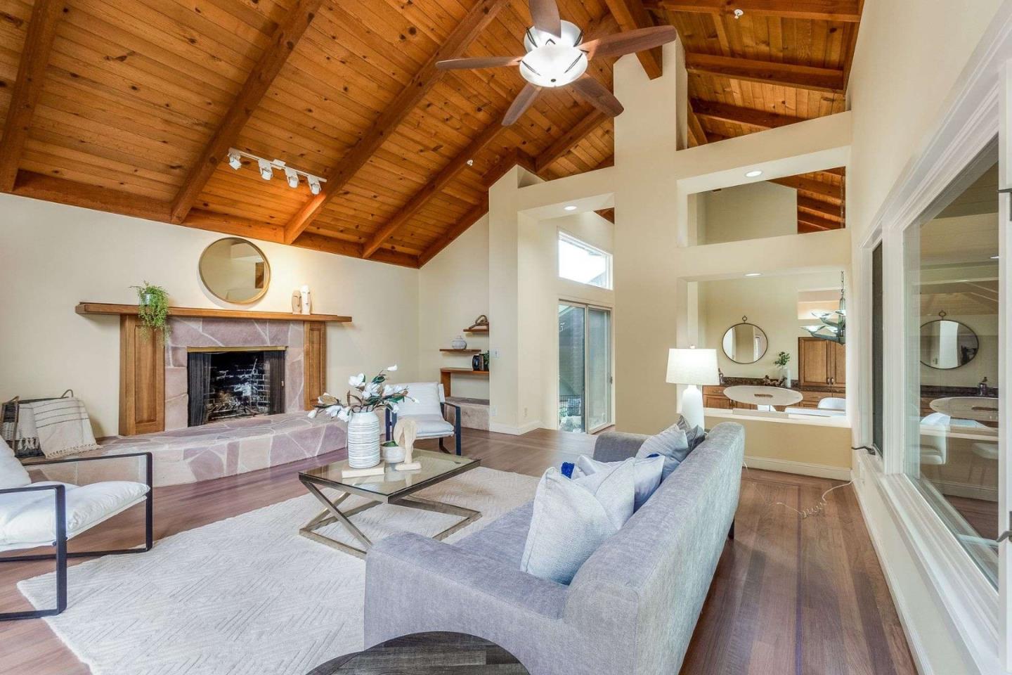22340 Regnart Road Cupertino, CA 95014 - Photo 13 of 74 a living room with furniture and a fireplace