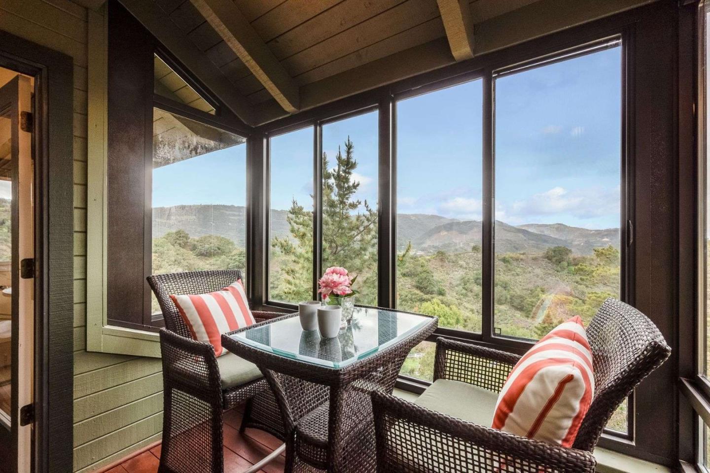 22340 Regnart Road Cupertino, CA 95014 - Photo 15 of 74 a living room with furniture and a large window