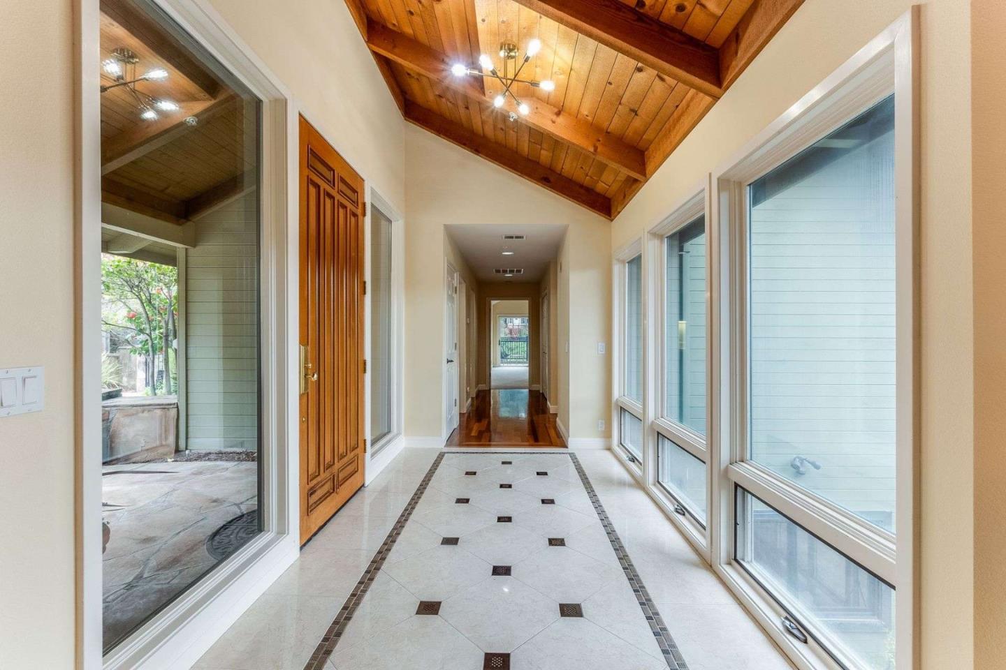 22340 Regnart Road Cupertino, CA 95014 - Photo 16 of 74 a view of a hallway view with windows