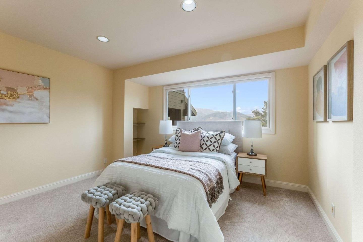 22340 Regnart Road Cupertino, CA 95014 - Photo 30 of 74 a bedroom with a bed and a cabinets