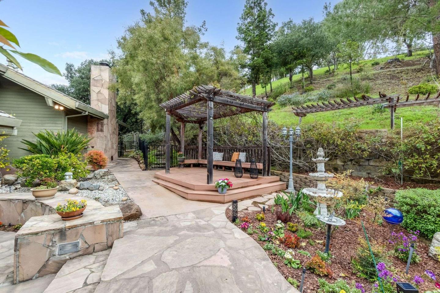 22340 Regnart Road Cupertino, CA 95014 - Photo 45 of 74 a view of a backyard with plants and patio