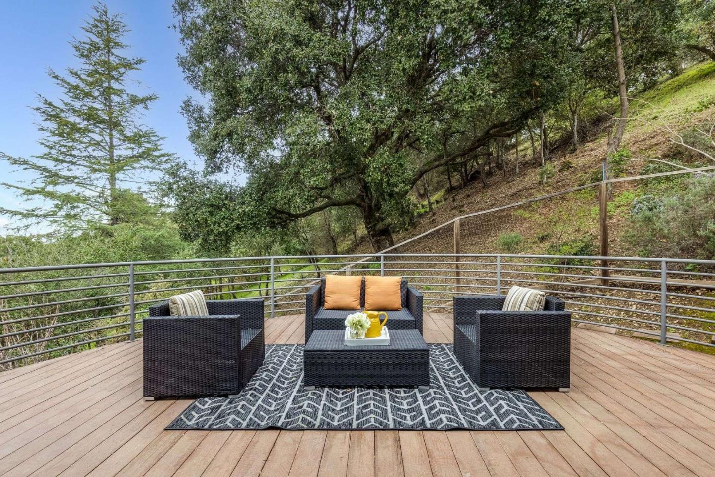 22340 Regnart Road Cupertino, CA 95014 - Photo 47 of 74 a wooden bench sitting on top of a wooden floor