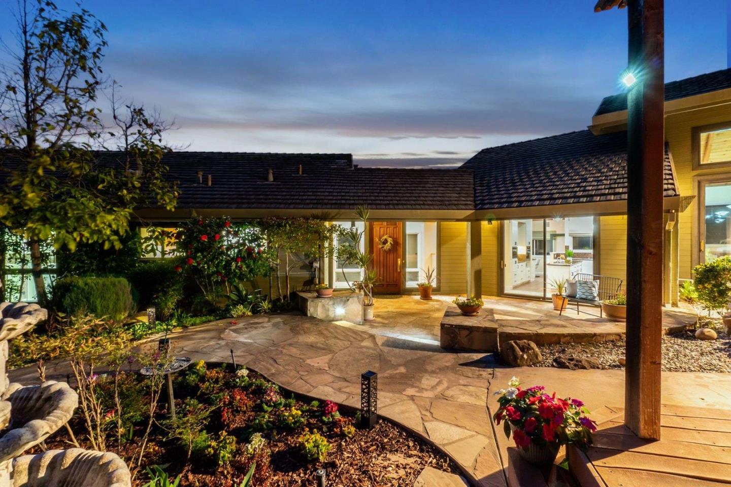 22340 Regnart Road Cupertino, CA 95014 - Photo 55 of 74 a living room with patio furniture and a floor to ceiling window