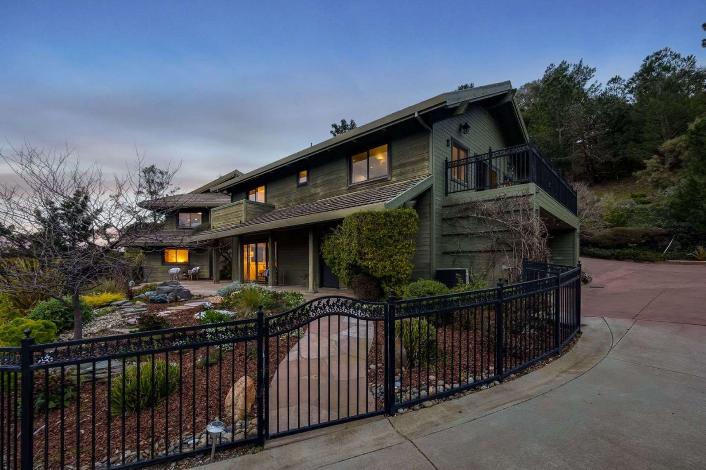 22340 Regnart Road Cupertino, CA 95014 - Photo 58 of 74 a front view of house yard and car parked