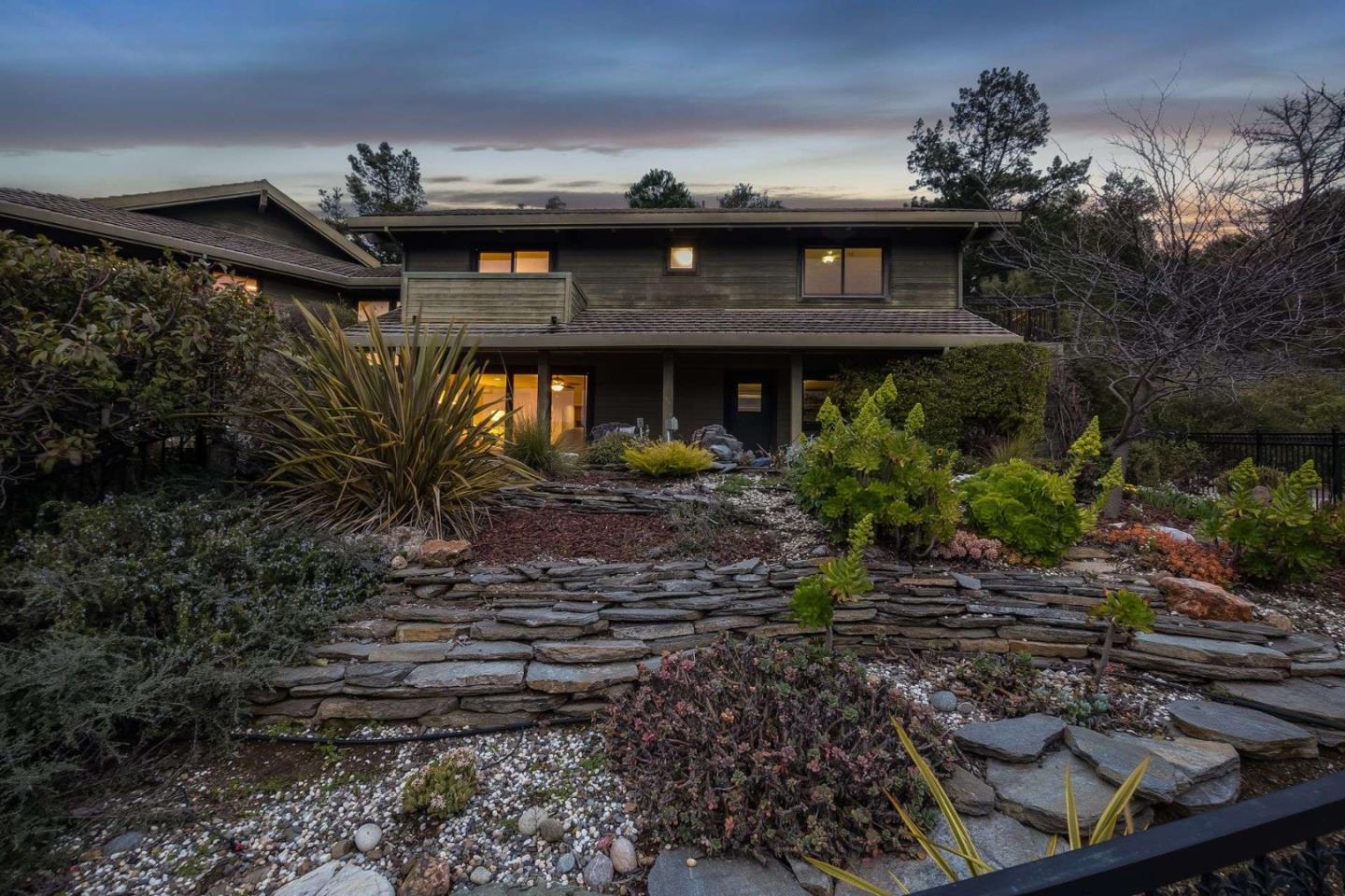 22340 Regnart Road Cupertino, CA 95014 - Photo 59 of 74 a front view of a house with plants