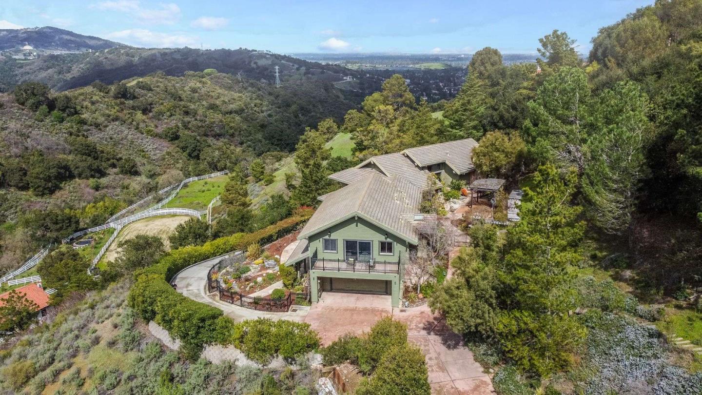 22340 Regnart Road Cupertino, CA 95014 - Photo 66 of 74 an aerial view of a house with a yard and a large tree