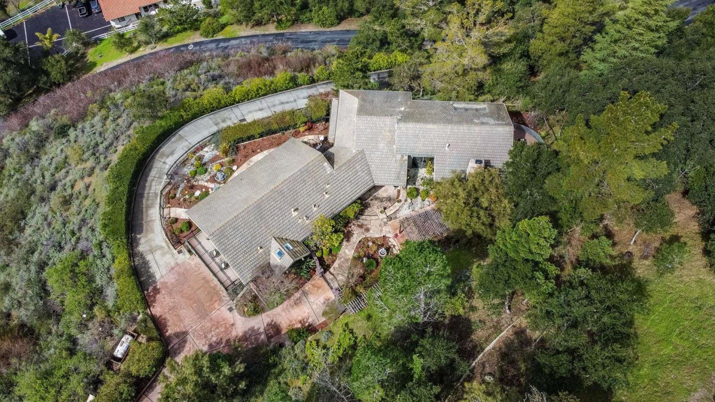22340 Regnart Road Cupertino, CA 95014 - Photo 67 of 74 an aerial view of a house with a swimming pool