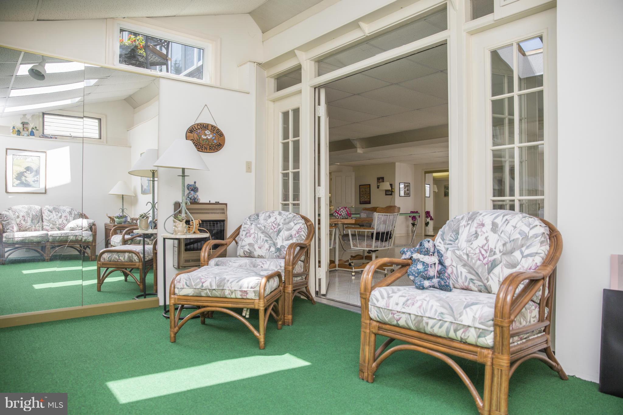2393 Bear Den Road Frederick, MD 21701 - Photo 22 of 30 a living room with furniture and a swimming pool