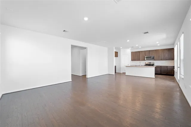 a view of a kitchen with a sink and cabinets