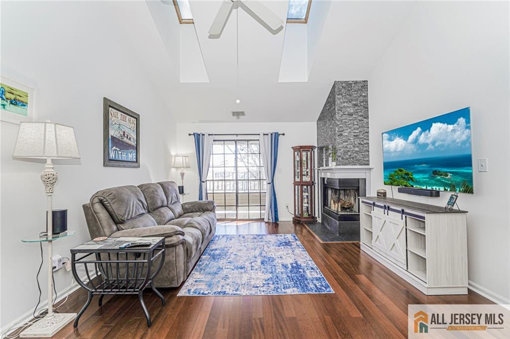 2710 Ridgefield Court Helmetta, NJ 08828 - Photo 10 of 32 a living room with furniture and a flat screen tv