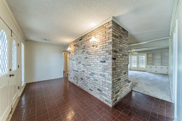 a view of livingroom with entryway and wooden floor