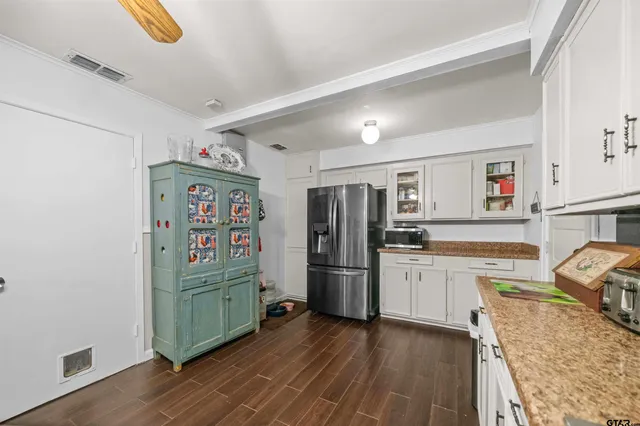 a view of hallway with wooden floor