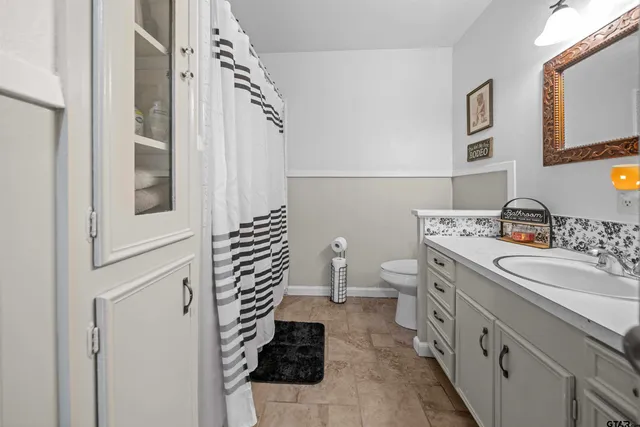 a bed room with a bed and a chandelier