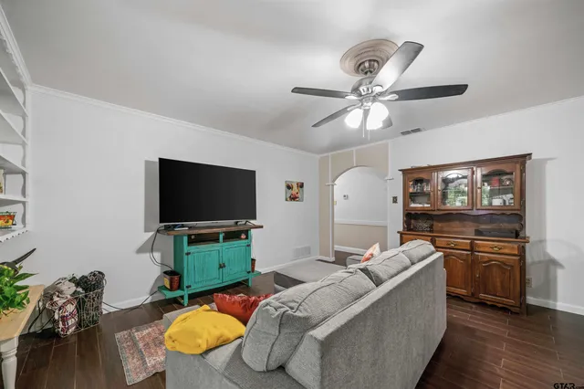 a kitchen with granite countertop stainless steel appliances and wooden floors