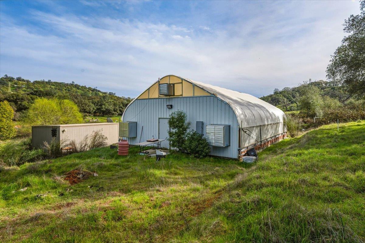 22545 Perimeter Road Grass Valley, CA 95949 - Photo 3 of 31 a view of house with backyard and garden