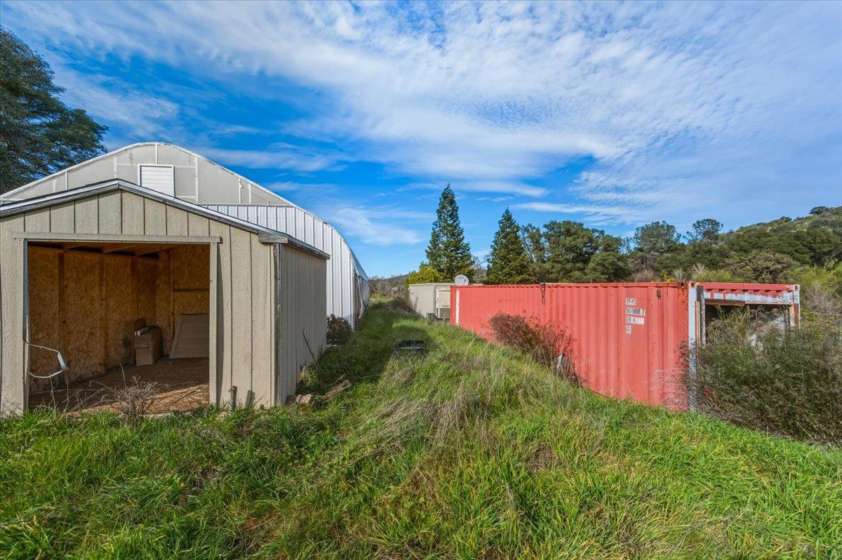 22545 Perimeter Road Grass Valley, CA 95949 - Photo 8 of 31 a front view of a house with garden