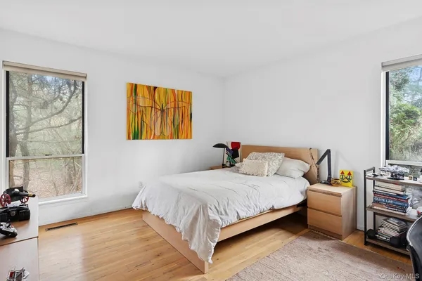 a bedroom with a bed furniture and a window