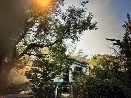 a white bath tub sitting next to a white cabinet