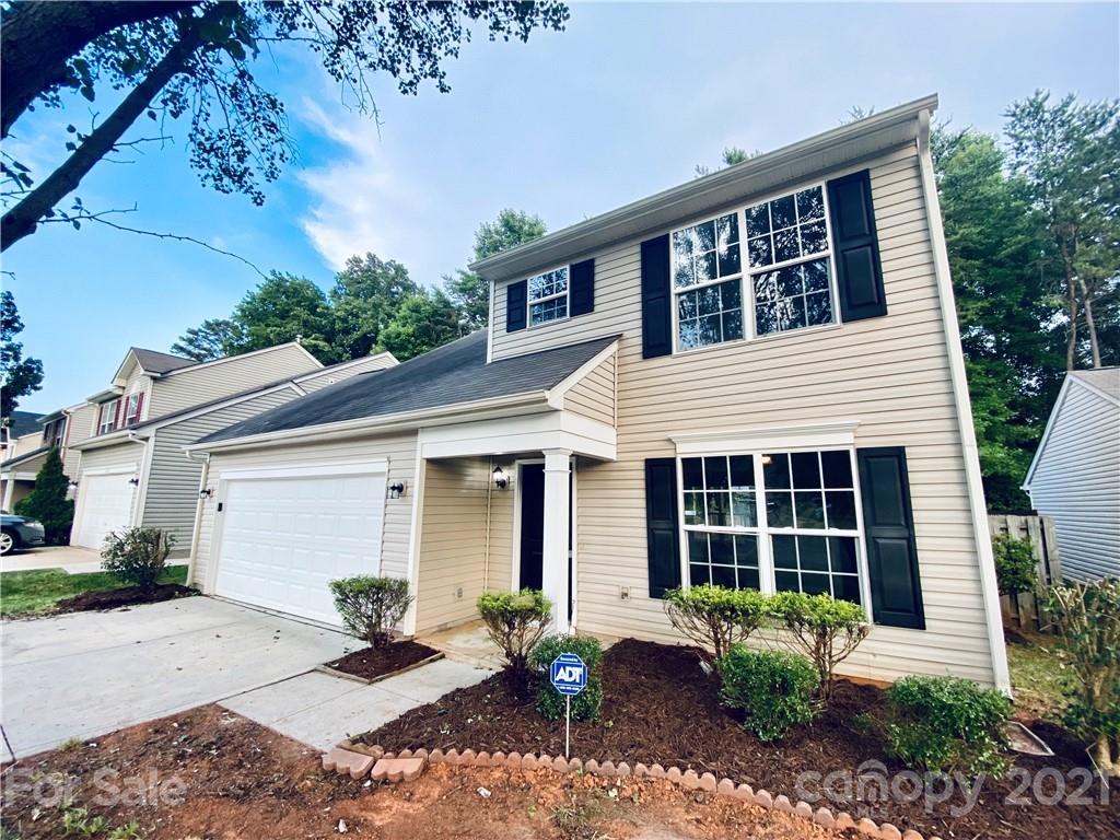 4916 Deerton Road Charlotte, NC 28269 - Photo 2 of 6 a front view of a house with garden