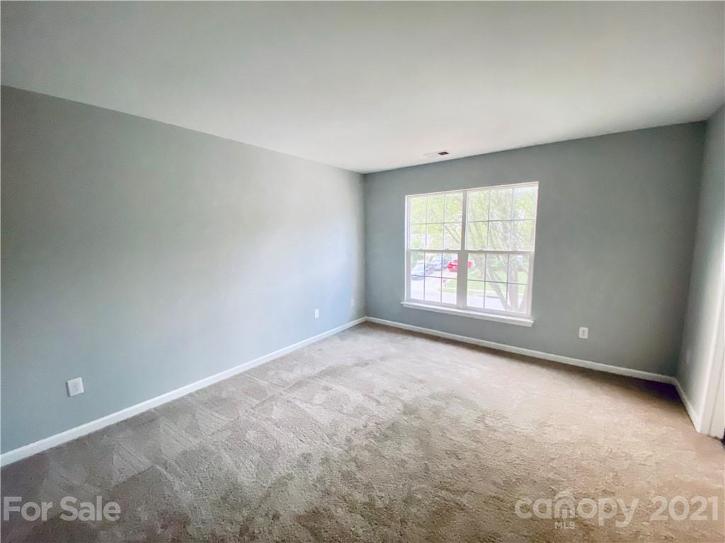4916 Deerton Road Charlotte, NC 28269 - Photo 6 of 6 an empty room with a window