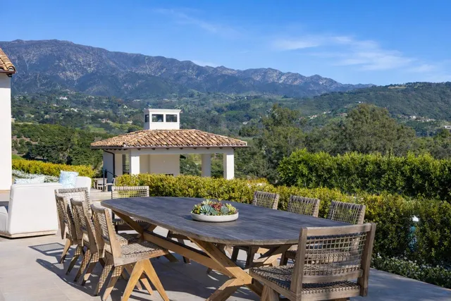 a view of a patio with furniture