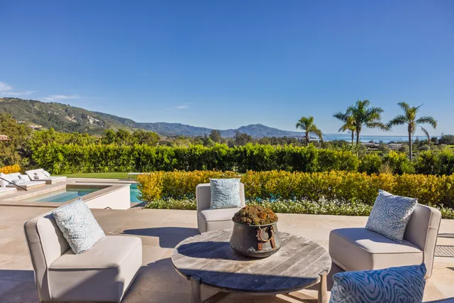 a view of a patio with couches chairs
