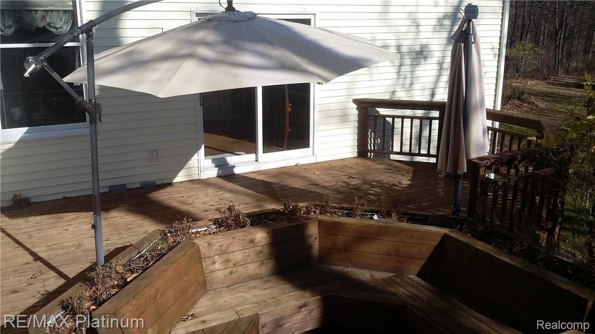 1383 North Hacker Road Howell, MI 48843 - Photo 27 of 34 large deck with built in seating