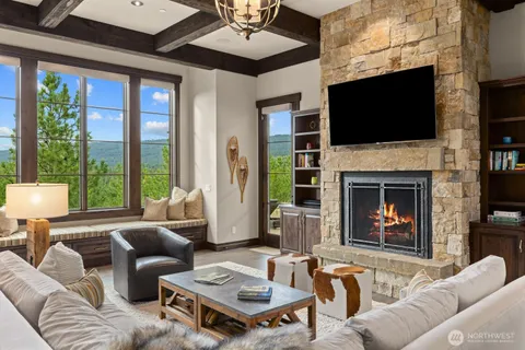 a living room with furniture fireplace and a flat screen tv