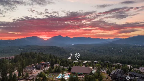 a view of a house with a mountain in the background