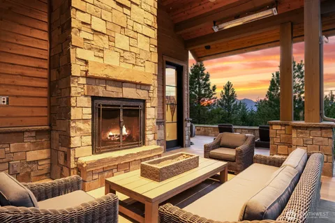 a outdoor living space with patio furniture and a fireplace