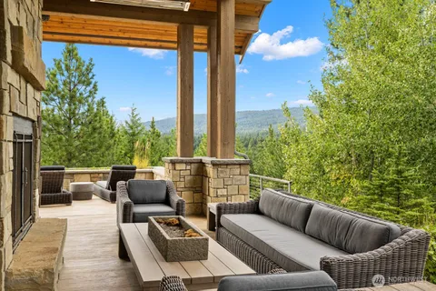 a view of patio with couches and potted plants