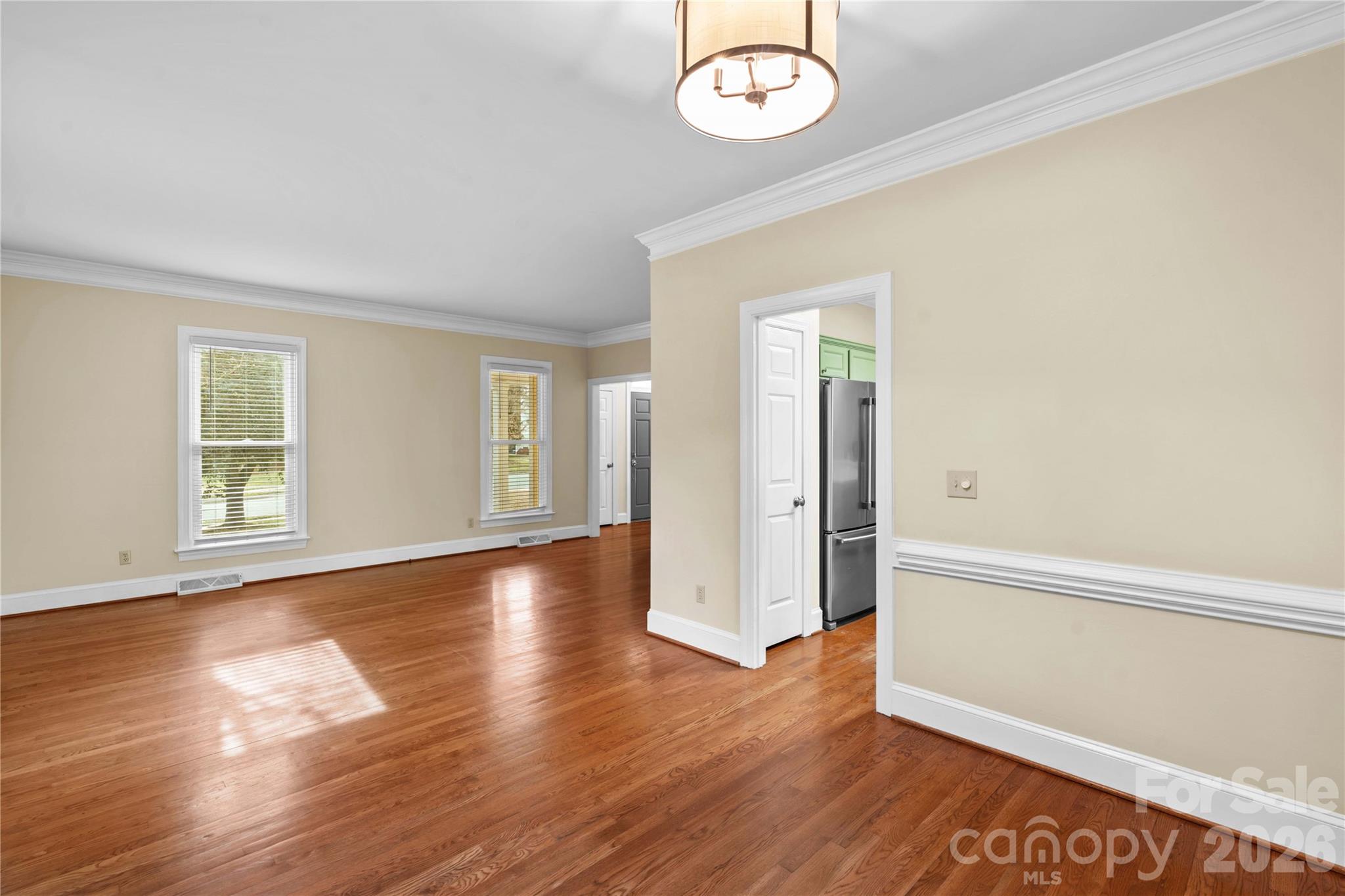 131 Morrison Hill Road Davidson, NC 28036 - Photo 16 of 47 an empty room with wooden floor and windows