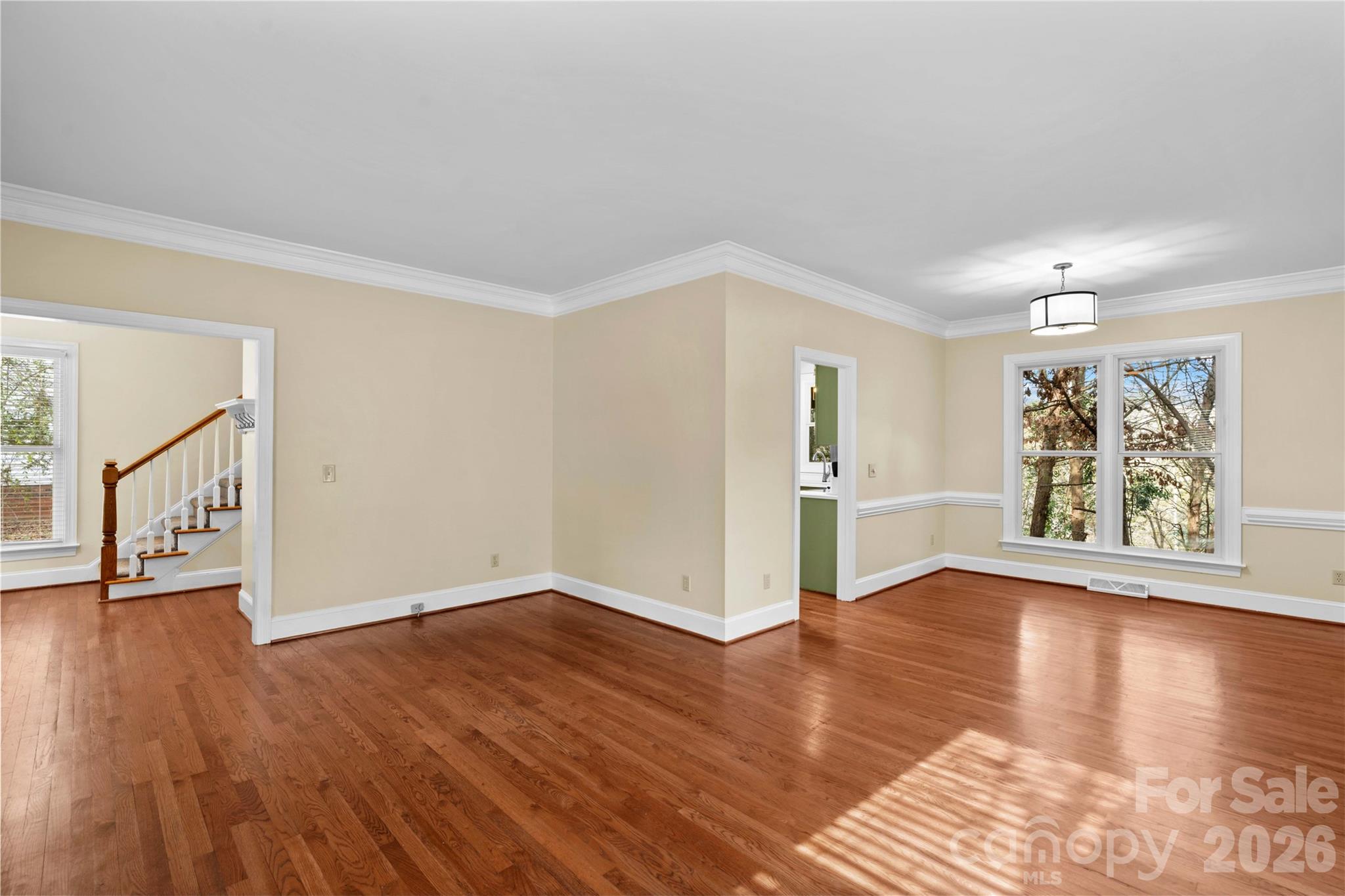 131 Morrison Hill Road Davidson, NC 28036 - Photo 20 of 47 a view of an empty room with wooden floor and a window