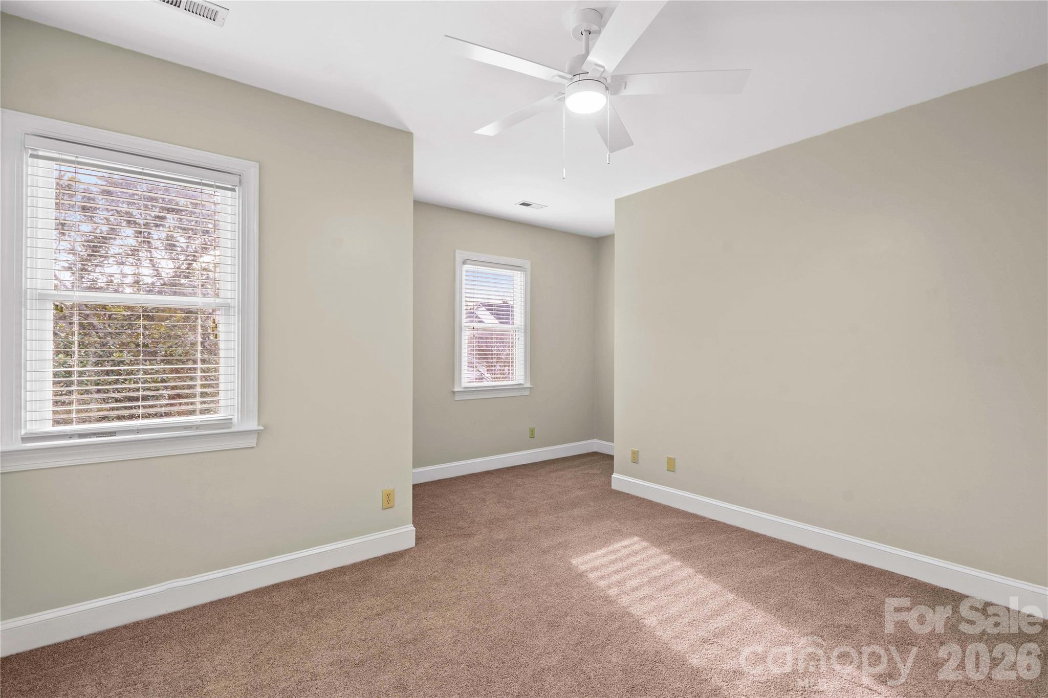 131 Morrison Hill Road Davidson, NC 28036 - Photo 30 of 47 an empty room with a window and ceiling fan