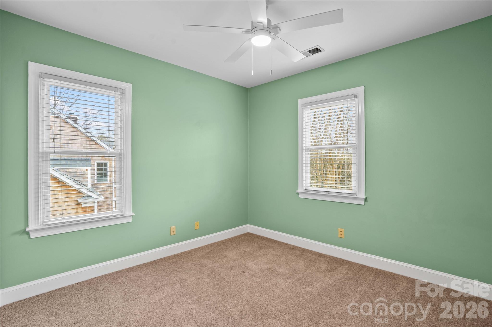 131 Morrison Hill Road Davidson, NC 28036 - Photo 32 of 47 an empty room with a window and ceiling fan