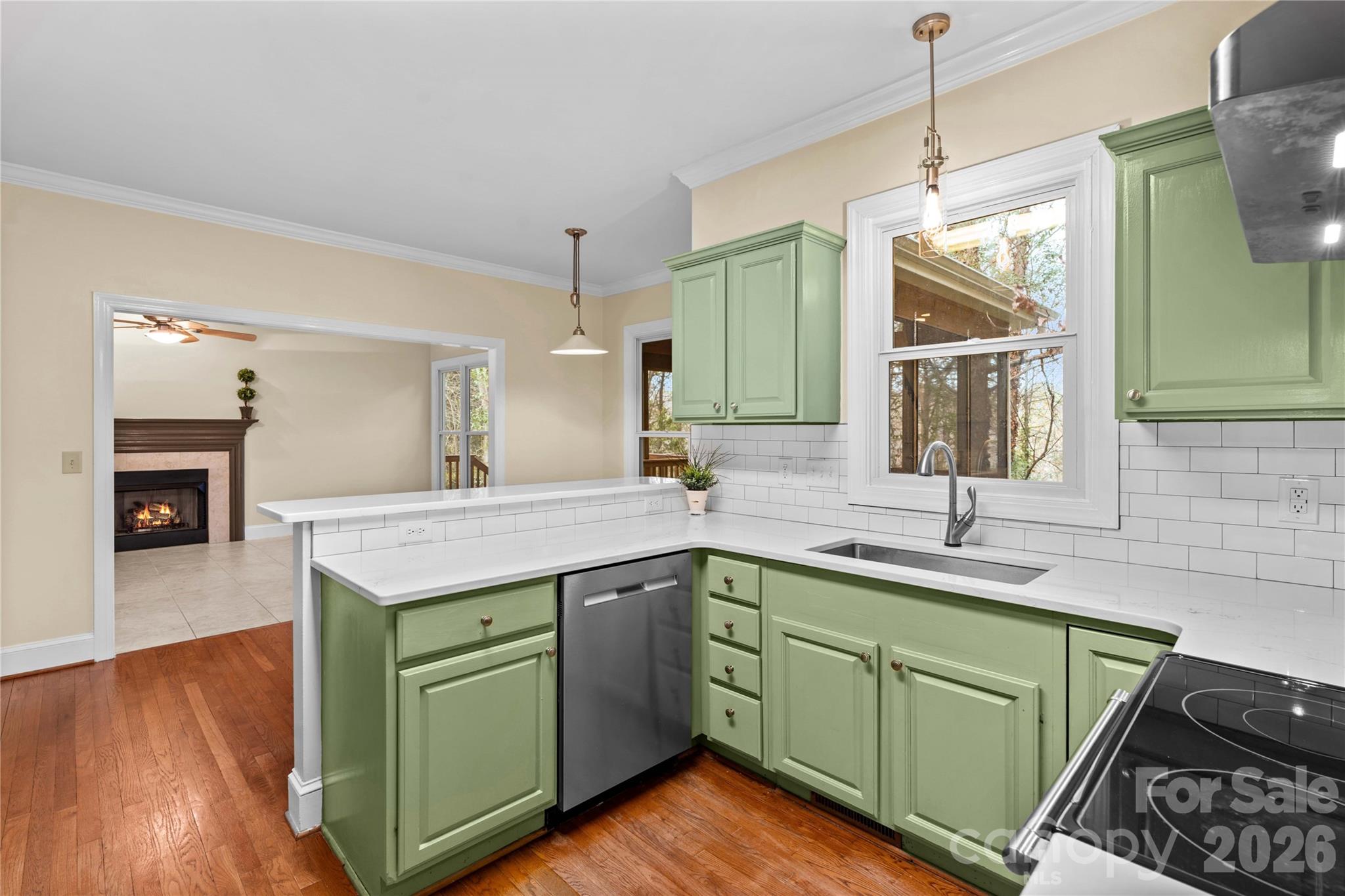 131 Morrison Hill Road Davidson, NC 28036 - Photo 4 of 47 a kitchen with a sink cabinets and wooden floor