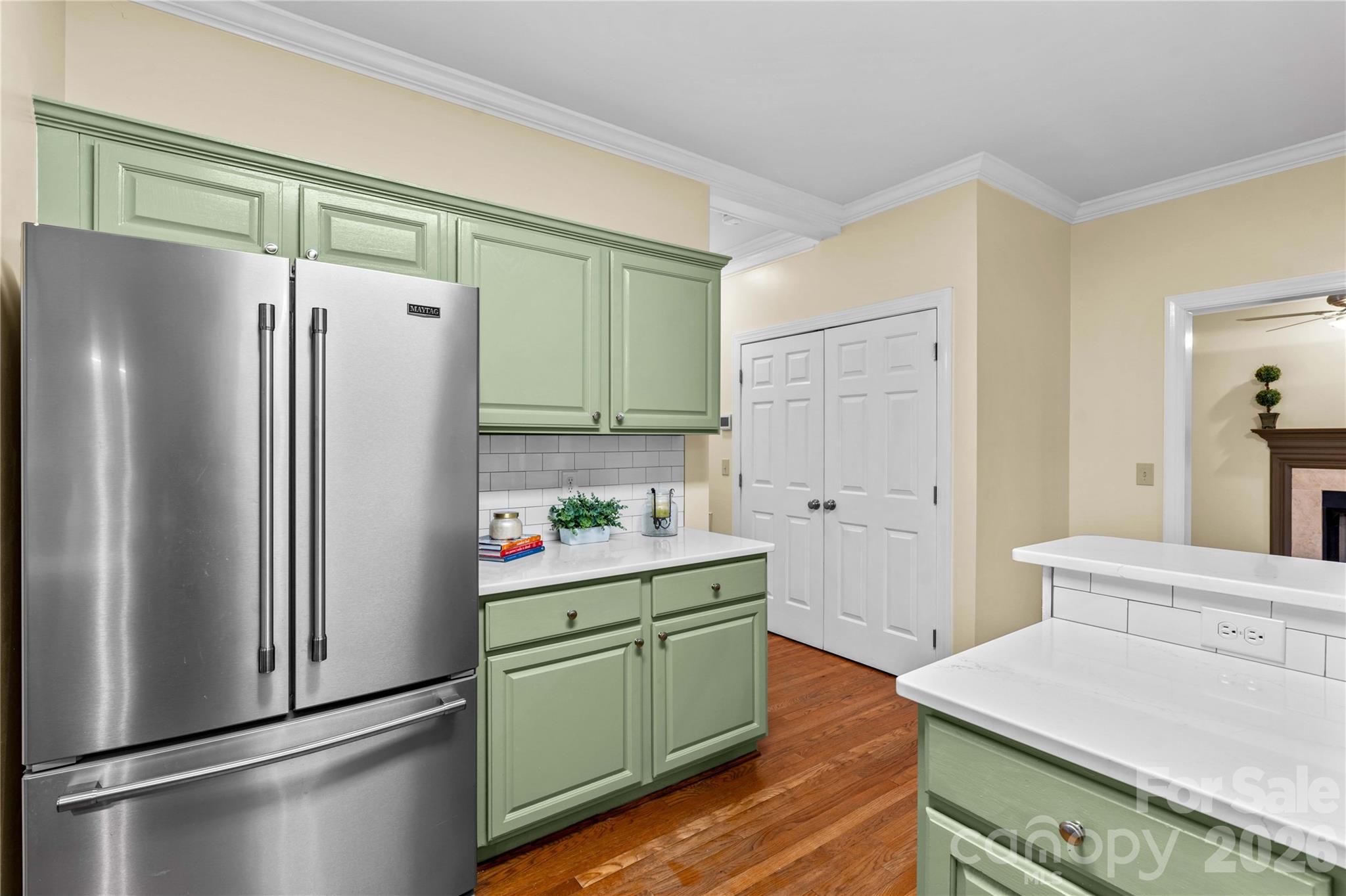 131 Morrison Hill Road Davidson, NC 28036 - Photo 5 of 47 a kitchen with a refrigerator and a sink