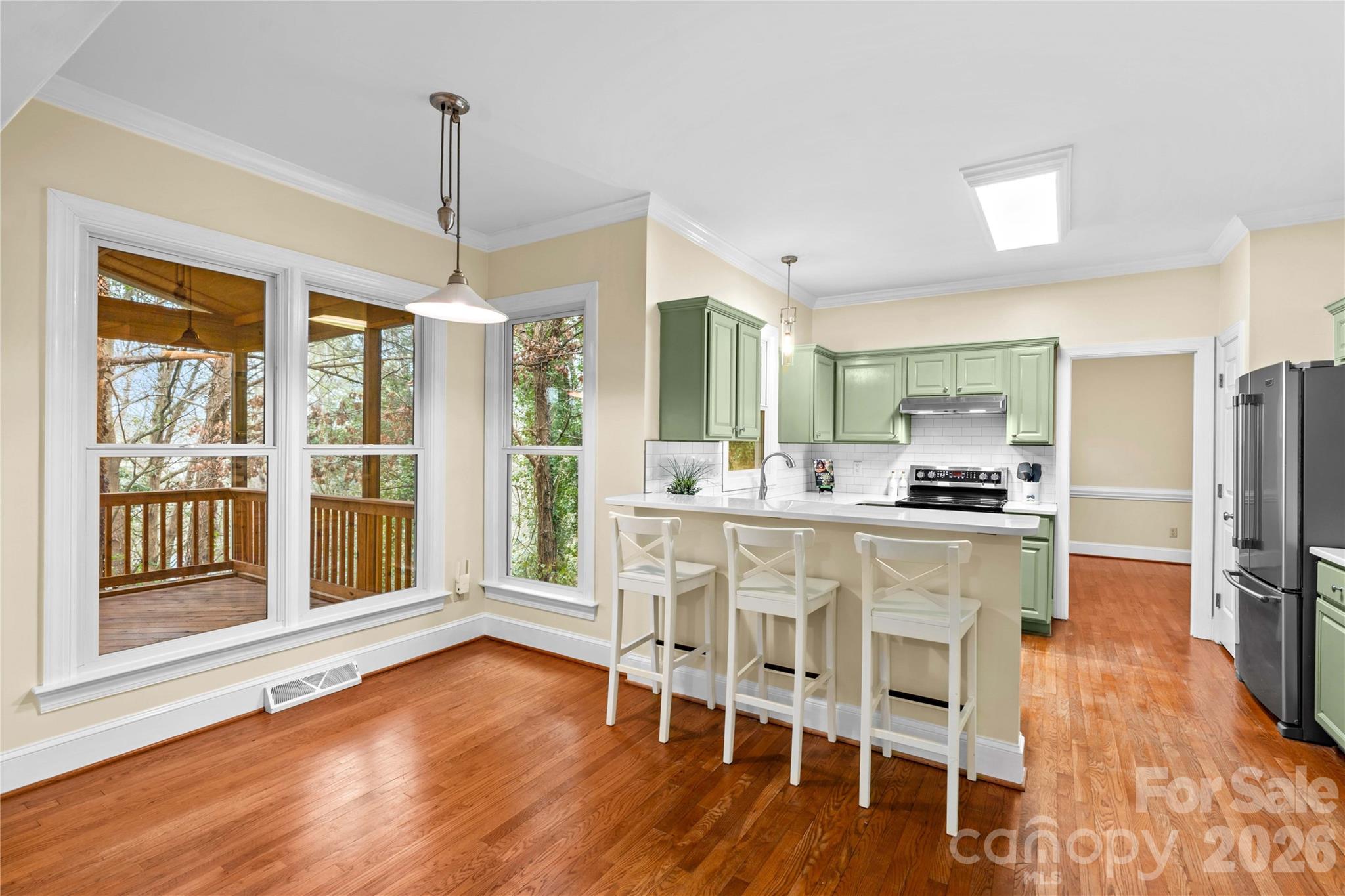 131 Morrison Hill Road Davidson, NC 28036 - Photo 8 of 47 a dining room with stainless steel appliances granite countertop furniture a chandelier and wooden floor