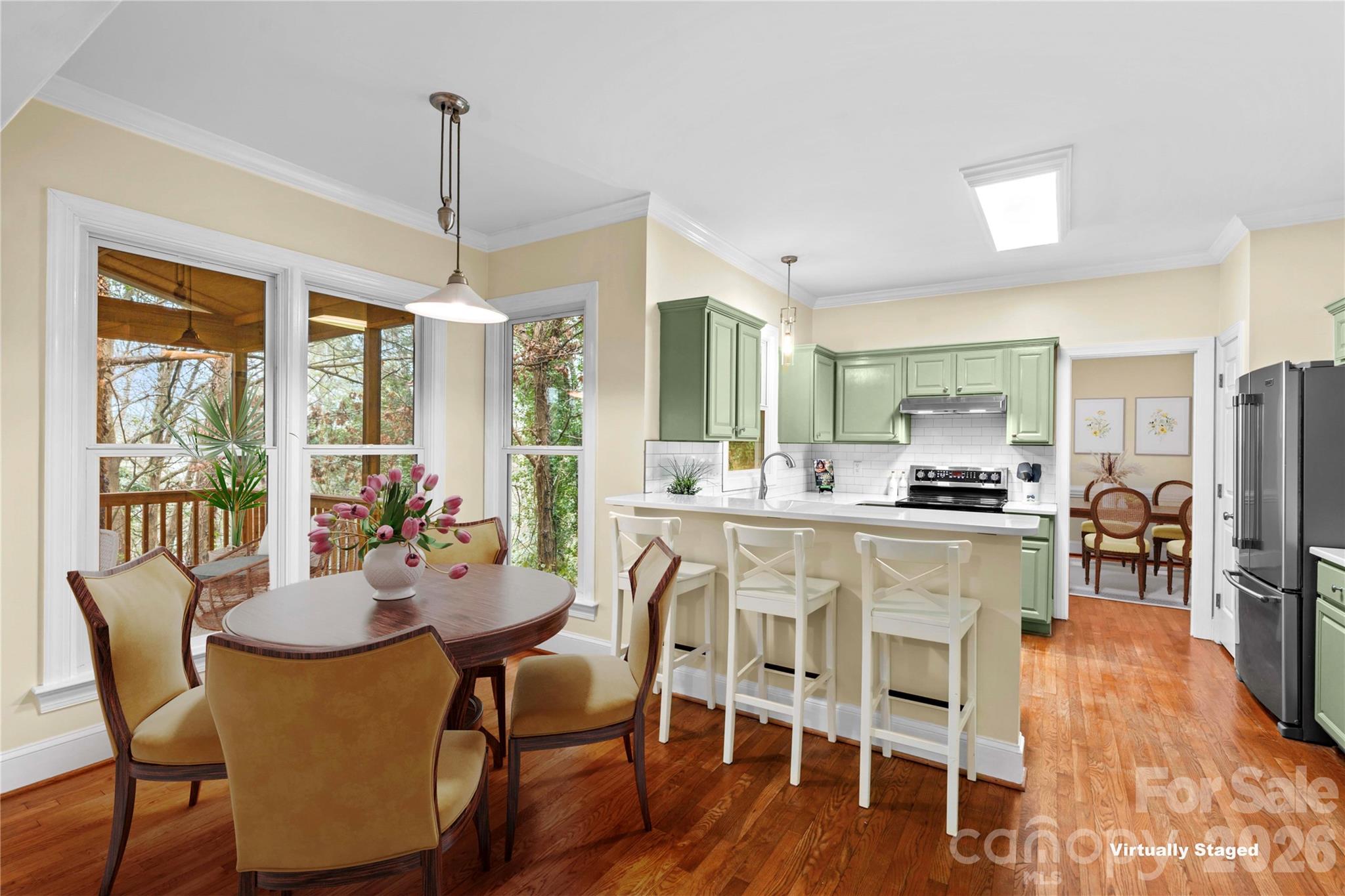 131 Morrison Hill Road Davidson, NC 28036 - Photo 9 of 47 a dining room with furniture a chandelier and wooden floor