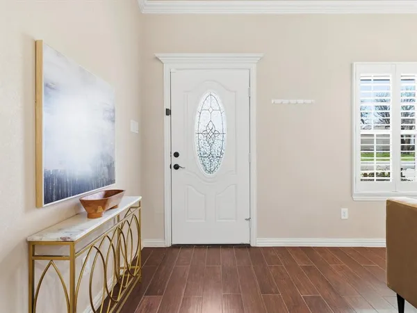 a view of an entryway with wooden floor