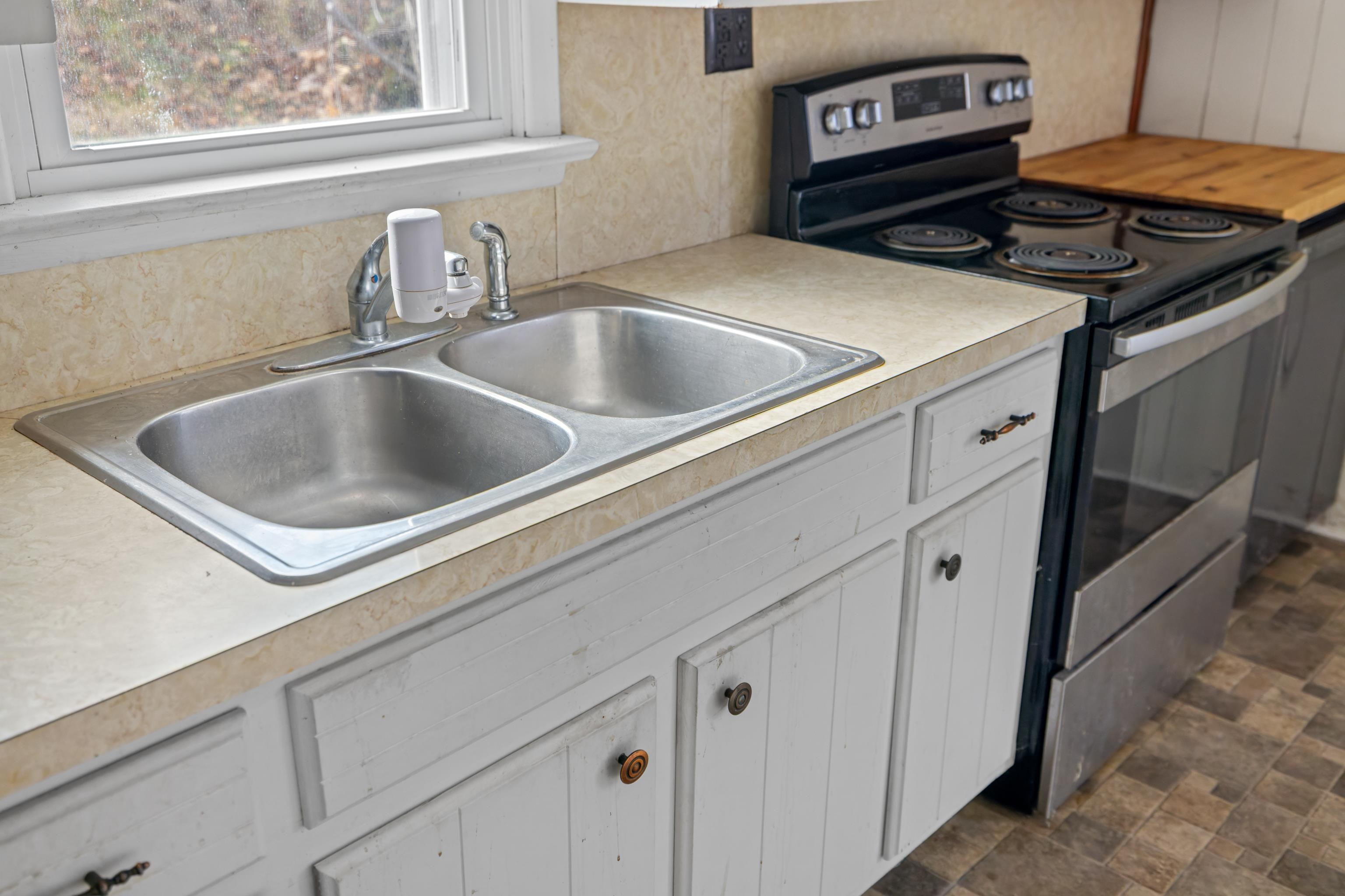 1340 B Street Waynesboro, VA 22980 - Photo 12 of 52 a kitchen with a sink and a stove