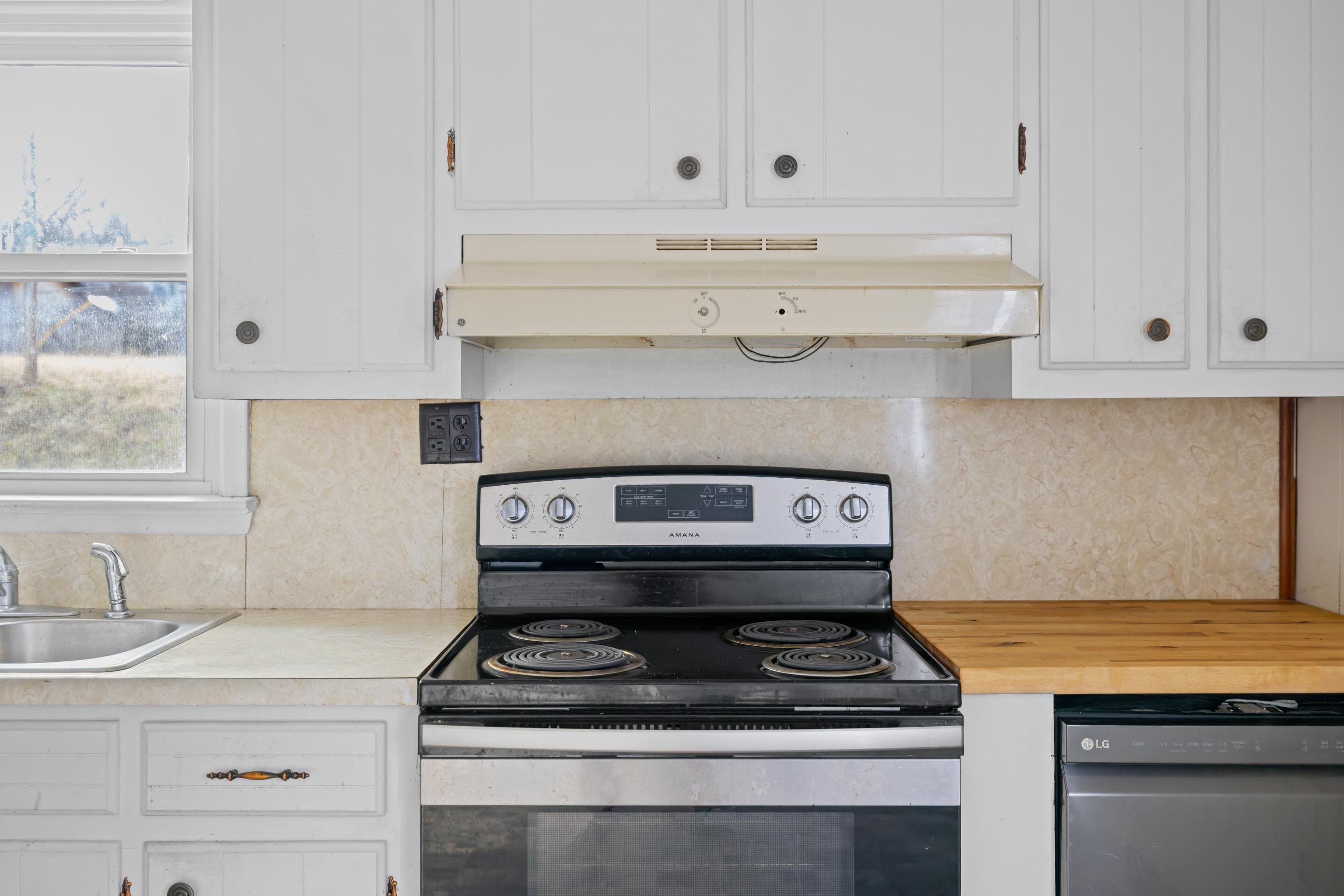 1340 B Street Waynesboro, VA 22980 - Photo 13 of 52 a stove top oven sitting inside of a kitchen