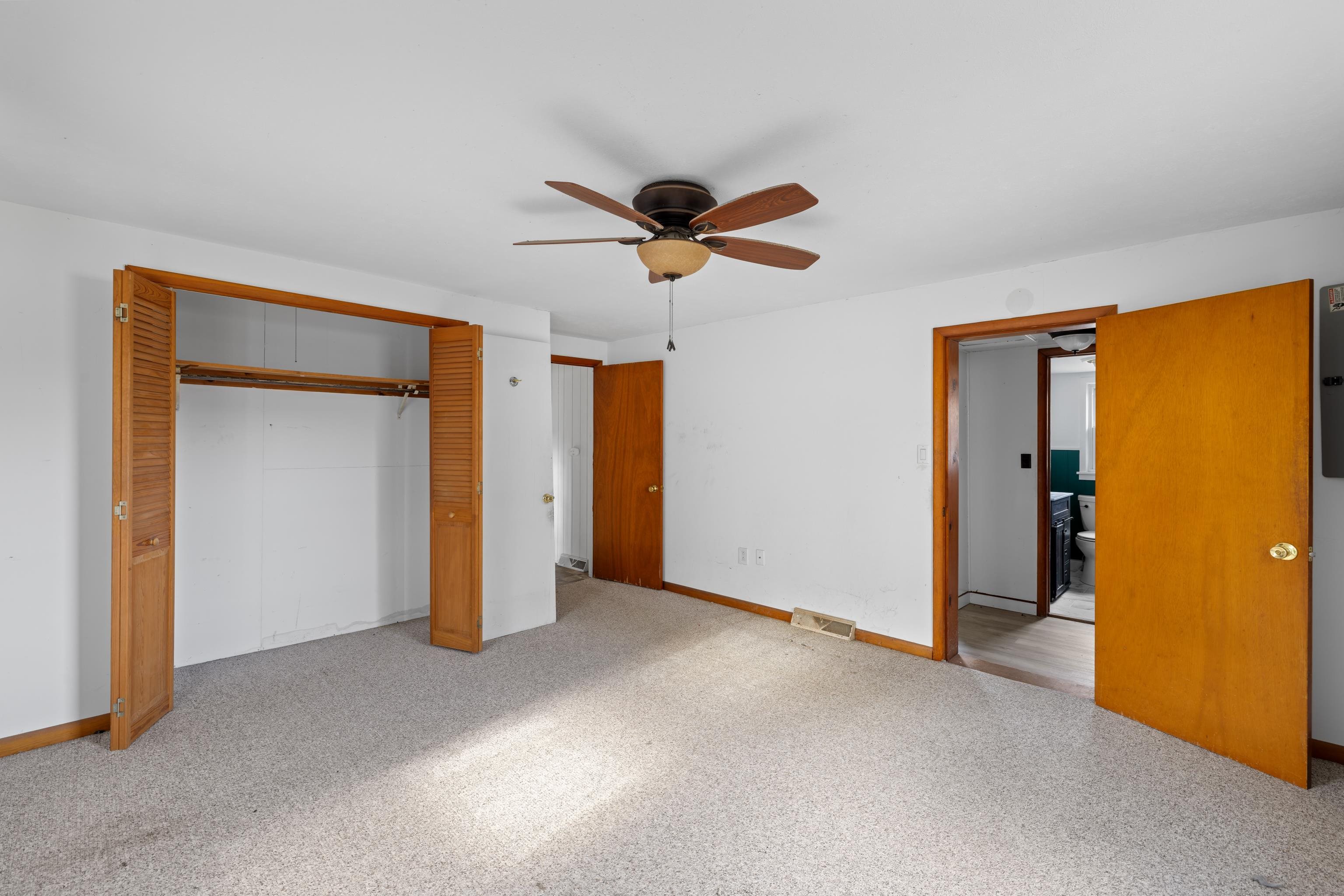 1340 B Street Waynesboro, VA 22980 - Photo 19 of 52 a view of a livingroom with a ceiling fan & windows