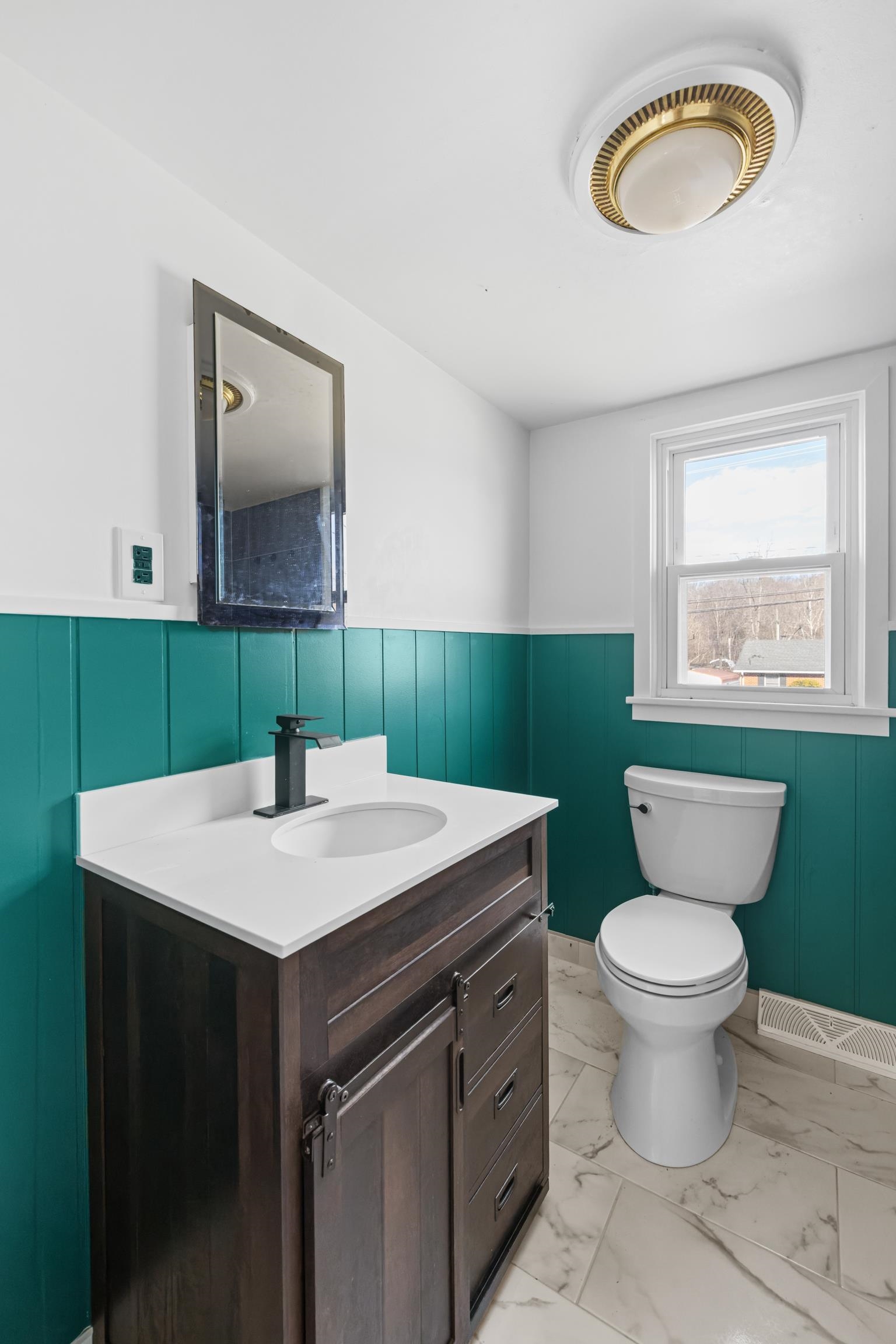 1340 B Street Waynesboro, VA 22980 - Photo 20 of 52 a bathroom with a toilet sink and mirror