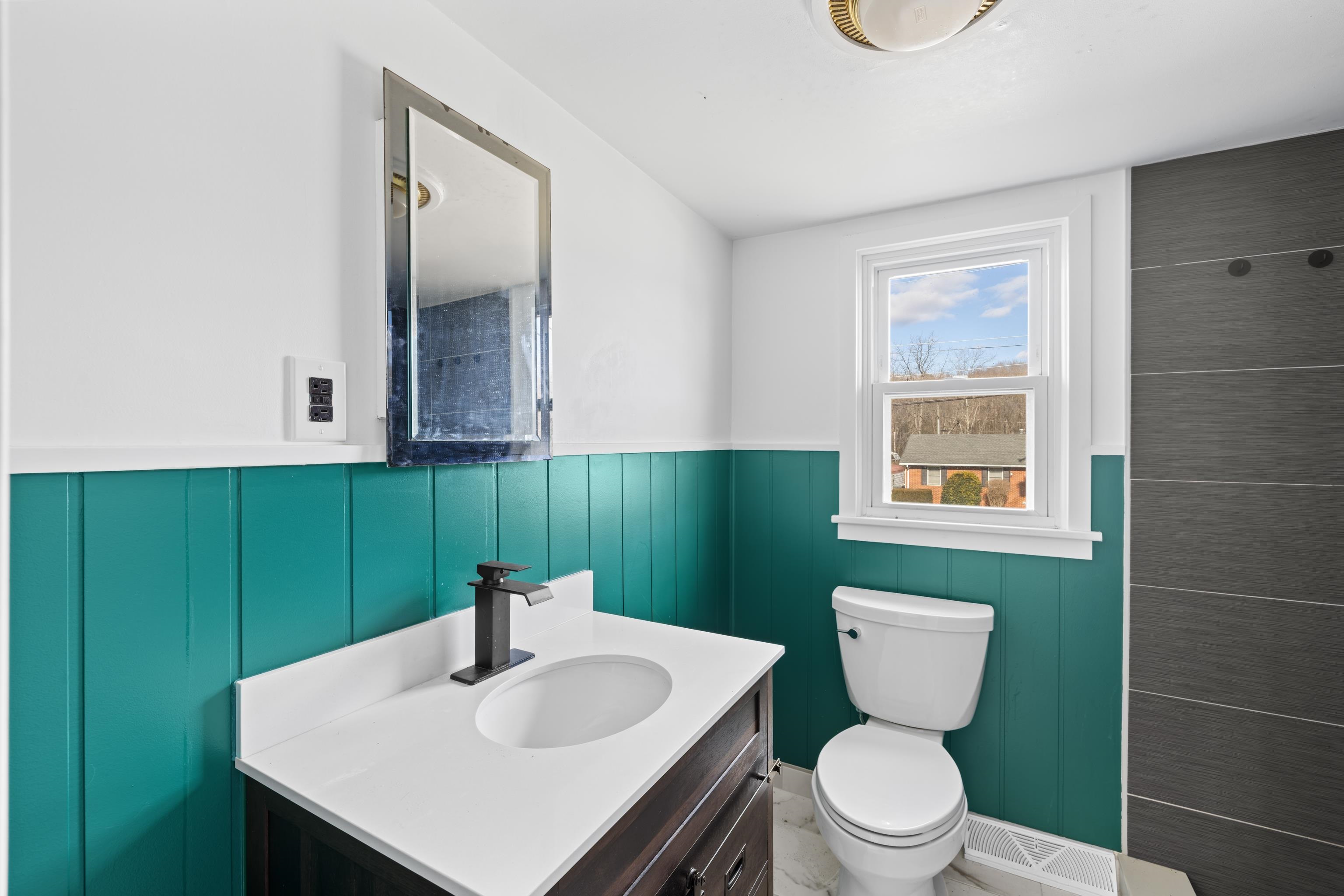 1340 B Street Waynesboro, VA 22980 - Photo 21 of 52 a bathroom with a sink toilet and mirror