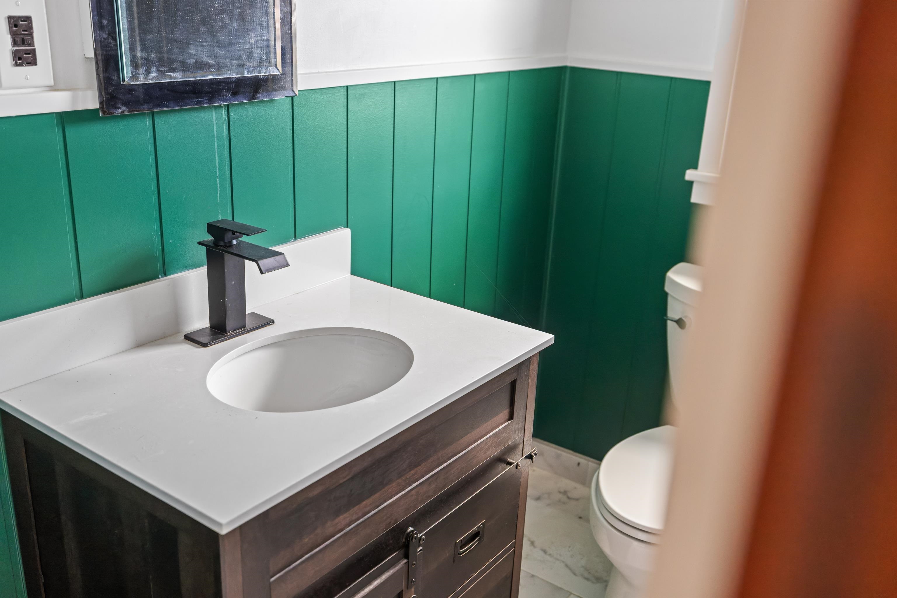 1340 B Street Waynesboro, VA 22980 - Photo 22 of 52 a bathroom with a sink toilet and green walls
